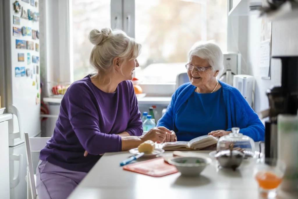 Elderly woman in kitchen with support worker